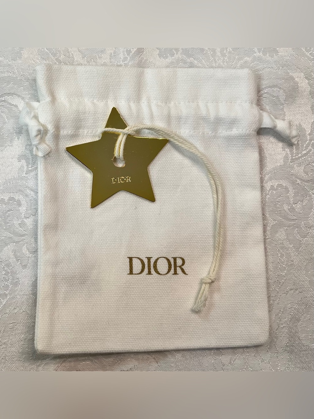 Dior White Drawstring Pouch with Gold Star Charm